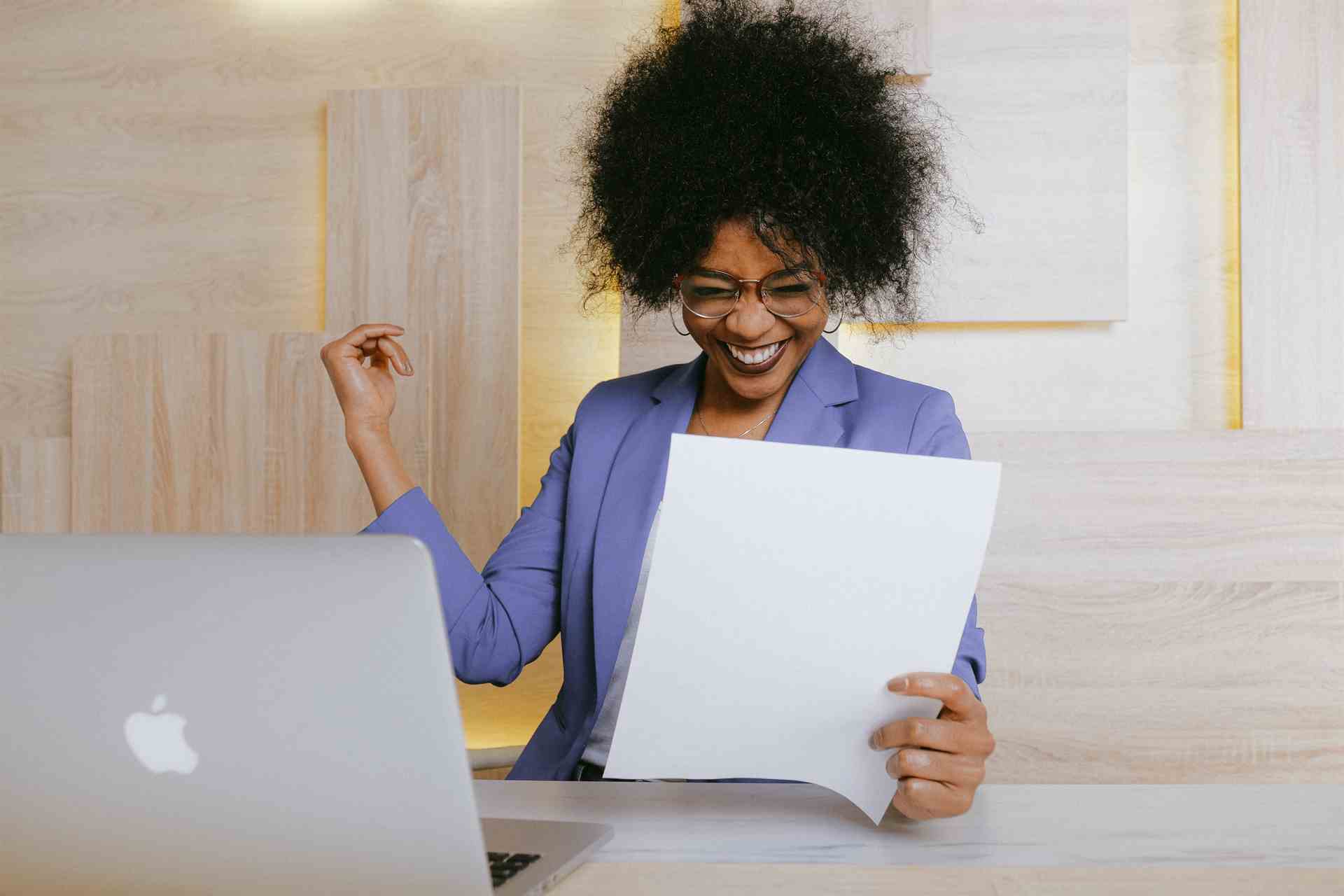 Image of two men happy to get a job through laptop