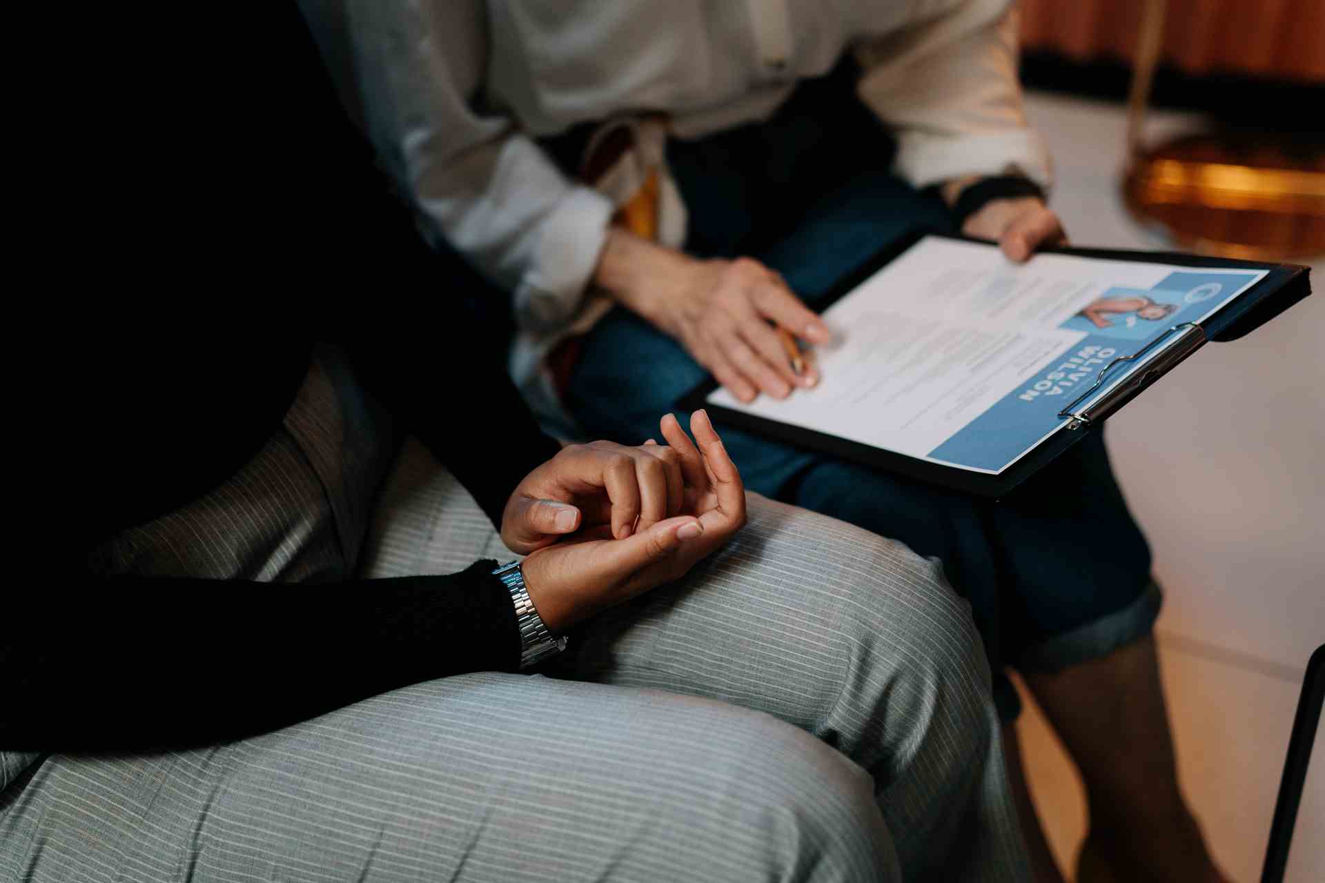 Image of a pair of hands typing on a laptop